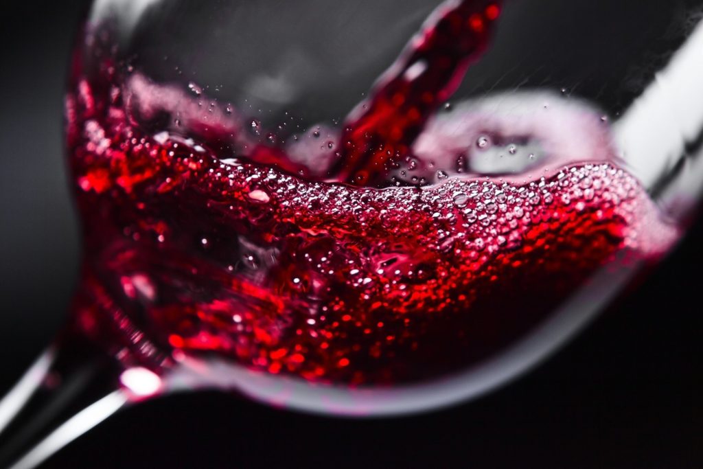 RED WINE Red wine in wineglass on black background Uploaded by: SINASAC